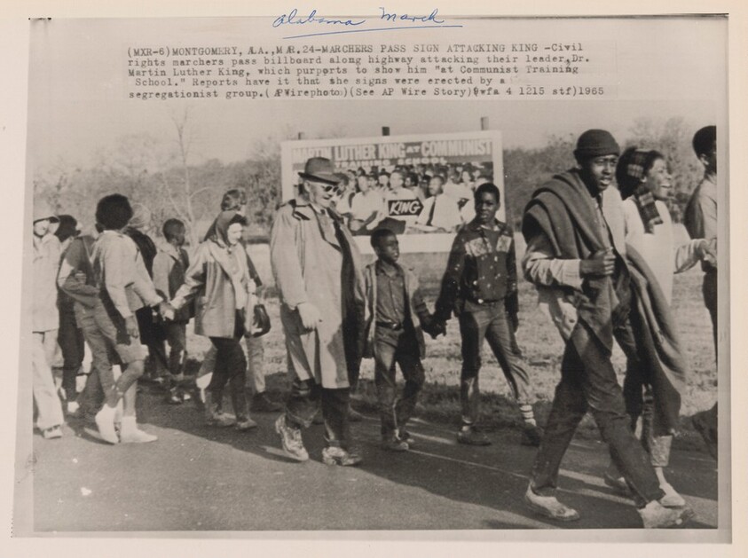 Title from caption on object: “Marchers Pass Sign Attacking King”