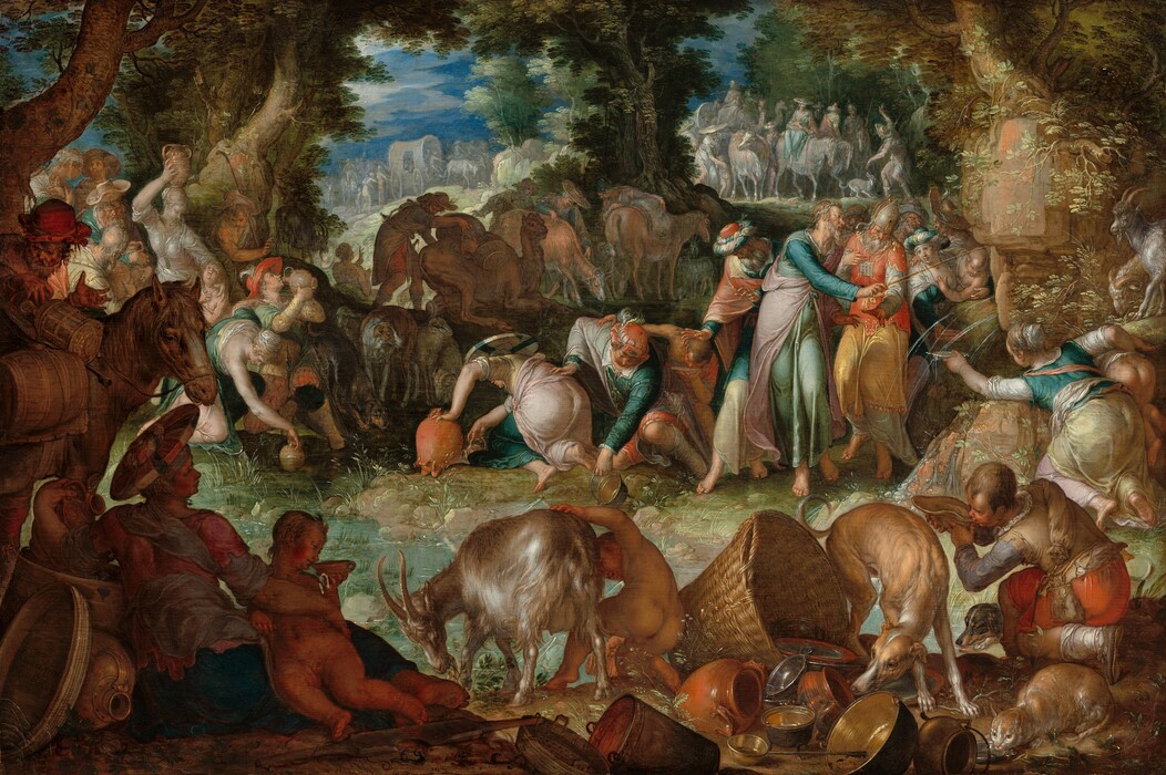 A group of light-skinned people and animals gather in an oval ring around a shallow pool in a wooded landscape in this horizontal painting. Deep in shadow but closest to us, animals, objects, and people create a continuous band in the foreground. From left to right is a horse, a reclining woman and small child, a goat tended by a nude child, a dog sniffing at a pile of crockery, baskets, and metal pans and dishes, a cat lapping from a shallow pewter dish, and a young man drinking from a dish or large shell in the lower right corner. Beyond this and to our right, an older man with gray hair and beard and wearing turquoise, pink, and blue robes taps an outcropping of rocks with a thin rod. Water gushes in thin streams from the outcropping into the pool below. The bearded man is surrounded by several standing men and women. Men, women, and children bend over the edge of the pool around its perimeter, filling or drinking from jugs, dishes, and pans. Most of the men wear long robes and some wear turbans, and the women wear long dresses or robes in teal, aquamarine, shell pink, pale yellow, and ivory. Trees enclose this group to the left and at the center of the painting. Another band of dozens of people, animals, and wagons line the horizon in the distance. They are painted in pale gray, blue, pink, and white. The horizon line comes three-quarters of the way up the composition and glimpses of vibrant blue sky and white clouds are seen through breaks in the trees. Light glints off of clothing, smooth skin, the fur of the animals, and especially the metalware in the foreground to give the painting a glimmering, almost glossy look.