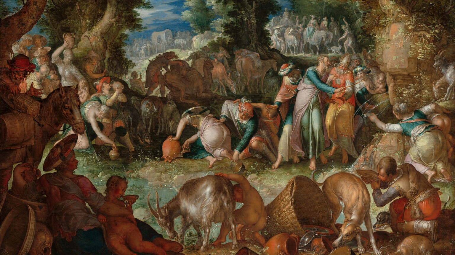 A group of light-skinned people and animals gather in an oval ring around a shallow pool in a wooded landscape in this horizontal painting. Deep in shadow but closest to us, animals, objects, and people create a continuous band in the foreground. From left to right is a horse, a reclining woman and small child, a goat tended by a nude child, a dog sniffing at a pile of crockery, baskets, and metal pans and dishes, a cat lapping from a shallow pewter dish, and a young man drinking from a dish or large shell in the lower right corner. Beyond this and to our right, an older man with gray hair and beard and wearing turquoise, pink, and blue robes taps an outcropping of rocks with a thin rod. Water gushes in thin streams from the outcropping into the pool below. The bearded man is surrounded by several standing men and women. Men, women, and children bend over the edge of the pool around its perimeter, filling or drinking from jugs, dishes, and pans. Most of the men wear long robes and some wear turbans, and the women wear long dresses or robes in teal, aquamarine, shell pink, pale yellow, and ivory. Trees enclose this group to the left and at the center of the painting. Another band of dozens of people, animals, and wagons line the horizon in the distance. They are painted in pale gray, blue, pink, and white. The horizon line comes three-quarters of the way up the composition and glimpses of vibrant blue sky and white clouds are seen through breaks in the trees. Light glints off of clothing, smooth skin, the fur of the animals, and especially the metalware in the foreground to give the painting a glimmering, almost glossy look.