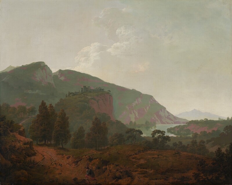 Mountains painted in tones of sage and mint green and mauve purple are backlit against a hazy sky in this expansive, nearly square landscape painting. In the bottom quarter of the composition, the dirt-packed land is partially covered with patches of scrubby grass. A person, tiny in the landscape, sits on a rock to the left of the bottom center of the painting. That person has pale skin and wears a wide-brimmed, dark hat, a slate-blue jacket, muted red pants, and shin-high boots. He rests his head in one hand, that elbow propped on his bent knee. He braces a stick, perhaps a walking stick, against the other shoulder, and a canteen hangs by one hip. A path starting in the lower left corner of the painting winds back into the deep distance. A complex of pale-colored buildings sits on a rocky cliff face near the center of the composition, and another complex is tucked on a distant mountain to the left. The mountains span the left two-thirds of the painting and taper down to meet a crescent-shaped body of water to the right. Another building in the deep distance near the right edge of the canvas is outlined against a smoky, pale blue ridge. White clouds pile in the hazy sky in the top half of the painting. The artist signed and dated the painting in the lower left corner, “I Wright Pinx 1790.”