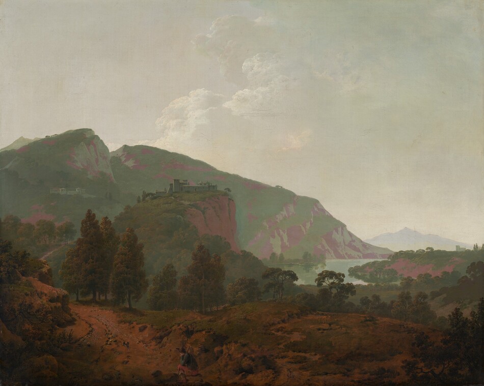 Mountains painted in tones of sage and mint green and mauve purple are backlit against a hazy sky in this expansive, nearly square landscape painting. In the bottom quarter of the composition, the dirt-packed land is partially covered with patches of scrubby grass. A person, tiny in the landscape, sits on a rock to the left of the bottom center of the painting. That person has pale skin and wears a wide-brimmed, dark hat, a slate-blue jacket, muted red pants, and shin-high boots. He rests his head in one hand, that elbow propped on his bent knee. He braces a stick, perhaps a walking stick, against the other shoulder, and a canteen hangs by one hip. A path starting in the lower left corner of the painting winds back into the deep distance. A complex of pale-colored buildings sits on a rocky cliff face near the center of the composition, and another complex is tucked on a distant mountain to the left. The mountains span the left two-thirds of the painting and taper down to meet a crescent-shaped body of water to the right. Another building in the deep distance near the right edge of the canvas is outlined against a smoky, pale blue ridge. White clouds pile in the hazy sky in the top half of the painting. The artist signed and dated the painting in the lower left corner, “I Wright Pinx 1790.”