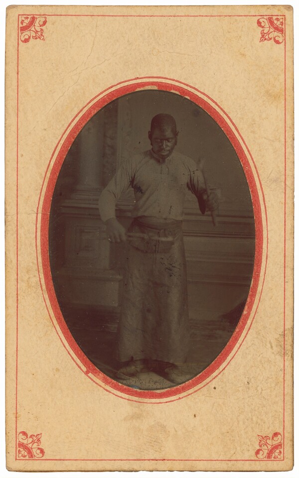 Portrait of a Man Holding Tools