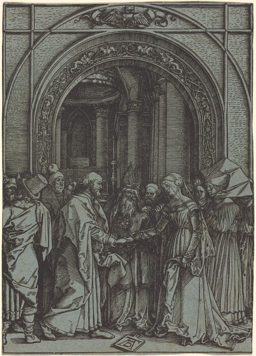 The image shows a group of people standing in the center of an ornate architectural setting. An elderly man with a long beard and a significant hat is holding the hands of a man and a woman. The man on the left is wearing a robe and a head covering, facing the woman on the right who is slightly bent forward and wearing a detailed gown with a headpiece. Other people in robes and various headdresses surround them, observing attentively. The background features an elaborate arched structure with intricate carvings and columns, creating a grand and solemn ambiance.