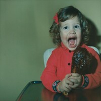 Untitled (Girl with piece of meat), American 20th Century, 1970s