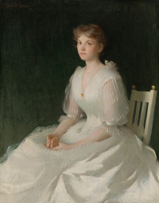 This painting depicts a woman seated in a tan chair. She is turned slightly to the left, and has light skin and short, wavy light brown hair. She has a small nose, thin lips, and dark eyes, and her face looks at us with a neutral expression. She is wearing a white dress with semi-transparent puffed sleeves. A gold brooch is fastened at the neckline of her dress. Her hands are intertwined in her lap. The background is a dark, muted green color.