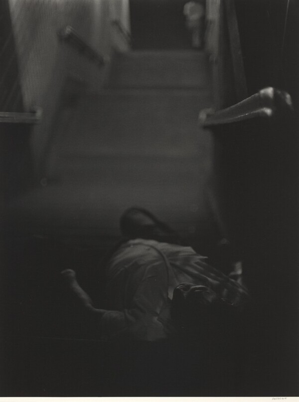 Man lying down, subway steps