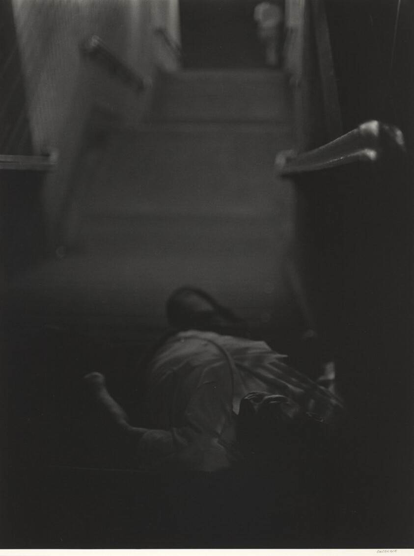 Man lying down, subway steps