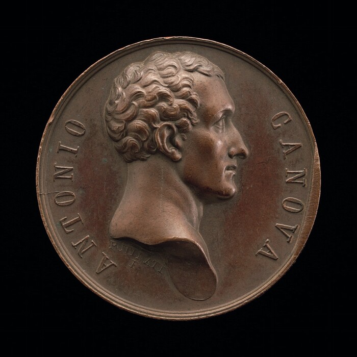 The image is a relief portrait of a man's head with detailed, wavy hair. The profile view highlights the nose and chin. Inscribed "ANTONIO CANOVA," it is a medallion made of bronze. The medallion is circular, with the portrait at the center and inscriptions around the edge. The material's texture and realistic facial features give the piece depth despite its flat form.