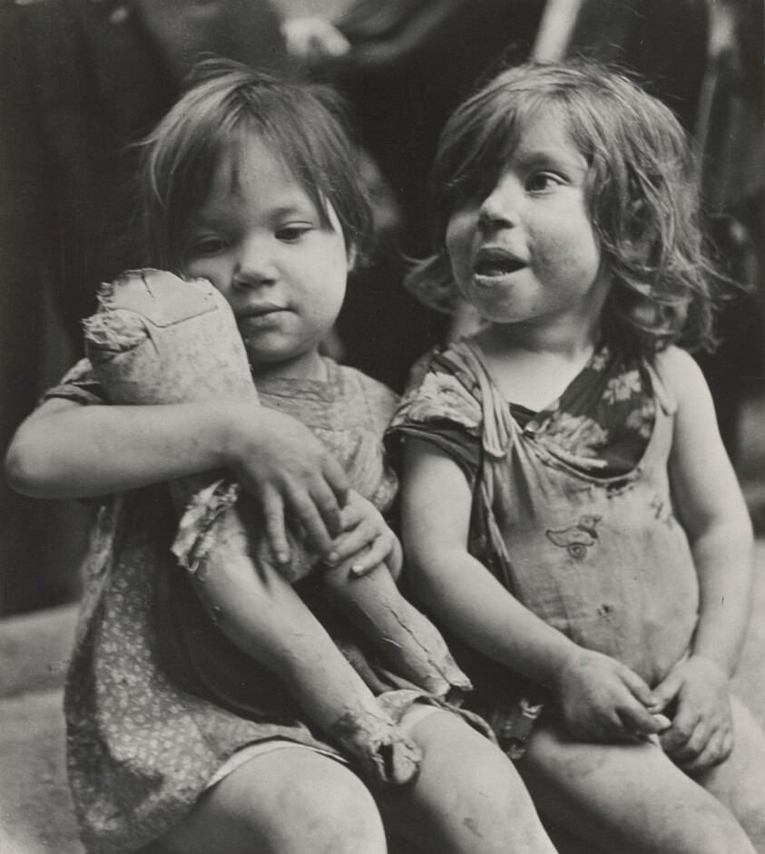 Children playing with something that was once a doll, Naples, Italy