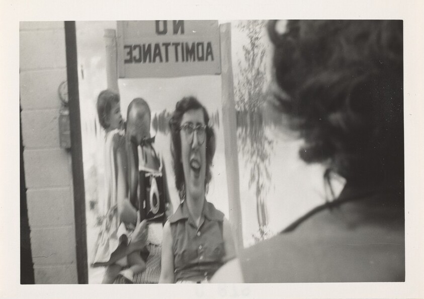 Untitled (Woman looking in distorted mirror)