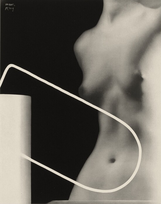 The image depicts various curved and straight lines intersecting in the foreground to create an abstract composition of shapes. There is a looping line that interacts with the forms, which include a cylindrical shape and a form resembling a human torso. The smooth surfaces and shadows emphasize the interaction between the geometric and organic elements, highlighting the contrasting textures and curves.