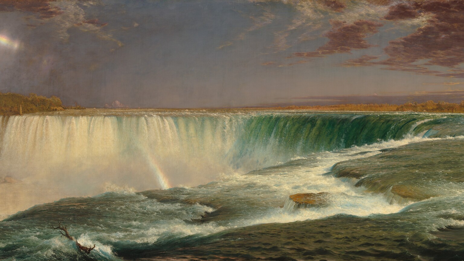 We hover over the bottle-green surface of a river as it rushes toward a horseshoe-shaped waterfall that curves away from us in this horizontal landscape painting. The water is white and frothy right in front of us, where the shelf of the riverbed changes levels near the edge of the falls. Across from us, the water is also white where it falls over the edge. A thin, broken rainbow glints in the mist near the upper left corner of the painting and continues its arc farther down, between the falls. The horizon line is just over halfway up the composition. Plum-purple clouds sweep into the composition at the upper corners against a lavender-colored sky. Tiny trees and a few buildings line the shoreline to the left and right in the deep distance.