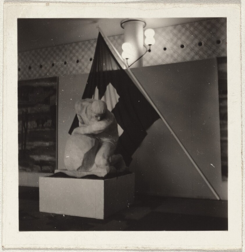 Sculpture before flag--Miscellaneous