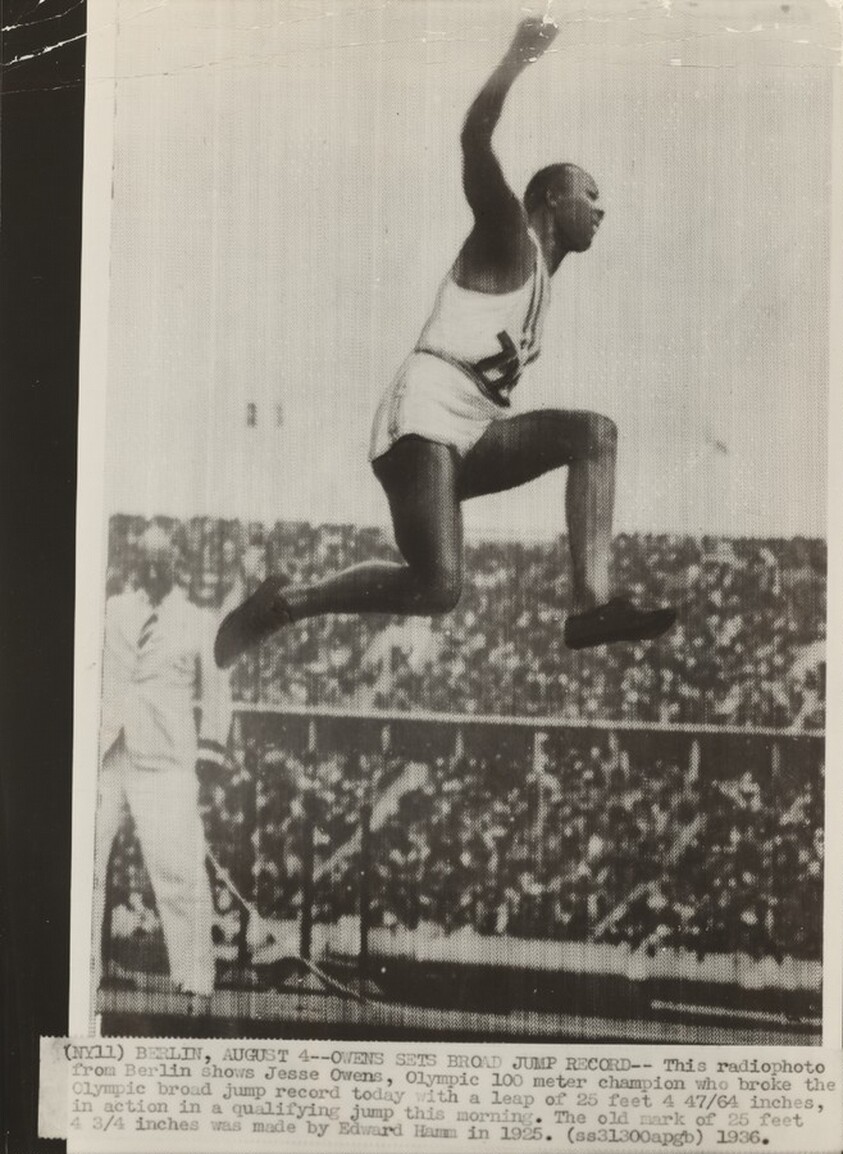 Title from caption on object: “Owens Sets Broad Jump Record”