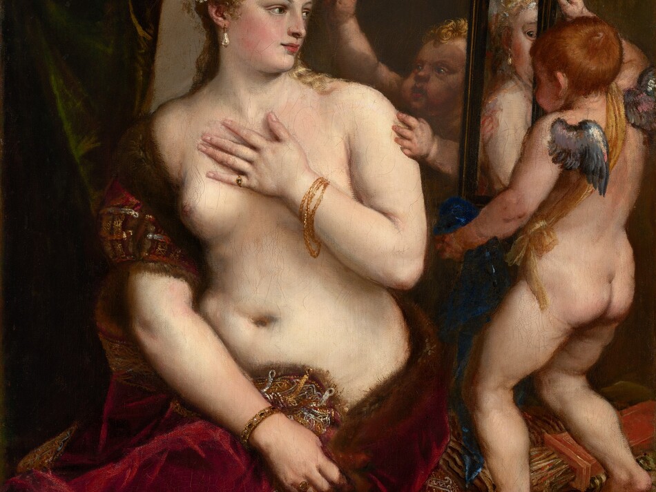 A partially nude woman with pale, peachy skin sits to our left looking into a mirror held up by a nearly nude, winged child to our right in this vertical painting. The woman’s body is angled to our left but she looks across her body to our right. She holds her left hand to her chest, and her right hand grips the fur-lined edge of the scarlet-red, velvet fabric that drapes over that upper arm and around her hips. Her blond hair is coiled up in rows of pearls, and she has dark eyes, a straight nose, and her pale pink lips turn up in a subtle smile. A teardrop pearl earring hangs from the ear we can see, and she wears rings and gold bracelets. The child-like figure to the right stands on a gold-striped cushion facing away from us as he holds up the rectangular, black-framed mirror. He has small silver wings and a sash of golden yellow hangs from one shoulder around the opposite hip. A second child reaches from behind the mirror to hold up a ring of laurel leaves. A forest-green curtain is gathered in the upper left corner and the beige wall beyond falls into shadow to our right.