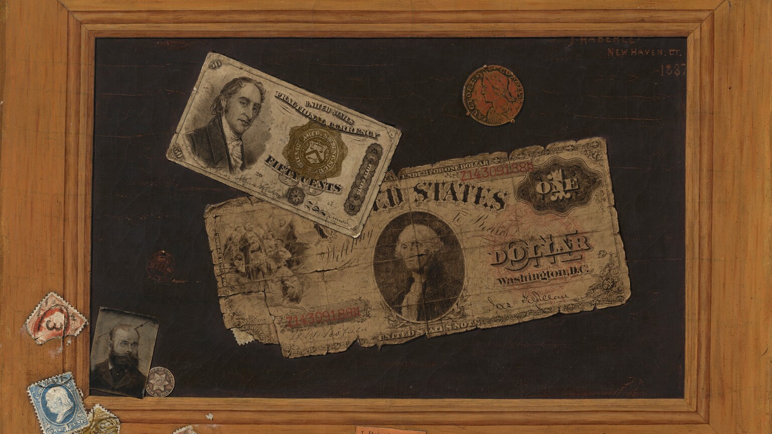 Two pieces of paper money, two coins, and a small black and white photograph of a bearded man seem to be affixed to a dark surface surrounded by a wide wooden frame, to which several stamps have been affixed in the lower left corner. A dollar bill with frayed edges is stuck to the black background across the center, and the lower left corner lifts up. The dollar bill has a portrait of George Washington in an oval at the center with “UNITED STATES” above. The serial number “Z143091888” appears in red to the left and is repeated in the upper right corner, and “ONE DOLLAR WASHINGTON DC” is printed in black to the right. Overlapping the top left of the dollar bill, another bill about half the size is printed with a portrait of a cleanshaven, light-skinned man in a high-necked coat and frilled collar, angled to our right but looking at us over a long, hooked nose and wide lips. To our right, the bill reads, “UNITED STATES FRACTIONAL CURRENCY,” and, below a seal, “FIFTY CENTS.” Above the dollar bill, a worn, copper-colored coin is held to the panel by three small prongs. The coin has the head of a person facing our left in profile. An inscription around the edge reads, “AUCTORI CONNEC.” A small photograph showing the head and shoulders of a bearded, balding man wearing glasses and a dark suit seems to have been tucked into the lower left corner between the dark background and the wood frame. Slightly behind the photograph, a silver coin resting on the ledge of the frame has a six-pointed star with a striped crest at the center, and is inscribed around the edge, “UNITED STATES OF AMERICA 1853.” Above the photograph is a dark circular stamp stuck with a pin. Attached to the bottom left corner of the wood frame are several different colored, cancelled stamps, some of them torn. In the bottom center, a piece of paper with the typed words “J. Haberle” seems to have been pasted onto the frame. The painting is inscribed in the upper right with red against the black field: “J. HABERLE NEW HAVEN, CT. 1887.” Upon closer inspection, we notice the edge of the wood frame is actually rough canvas. There also does not seem to be a gap between the painted picture and the wood frame. We eventually realize that all of it—the money, photograph, stamps, and frame—are all painted to create an illusion.