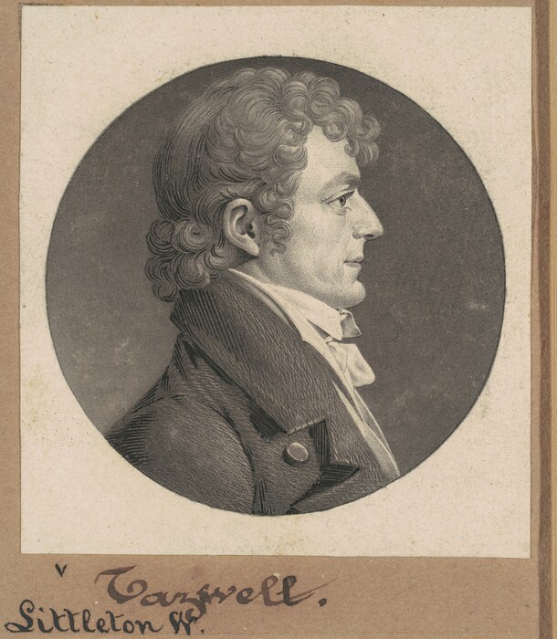 The image shows a side profile portrait of a man, with his upper body visible. He is positioned facing left. The man has prominent facial features with a strong nose and a well-defined chin. His hair is curly with volume on top and neatly styled around the ears. He is dressed in formal clothing, consisting of a dark coat with large buttons and a white cravat or stock around his neck. There are no visible jewelry or objects he is holding. The background is a plain oval shape providing a neutral backdrop, surrounded by the beige color of the paper, with handwriting on the bottom part, reading "Tazewell" and "Littleton W."