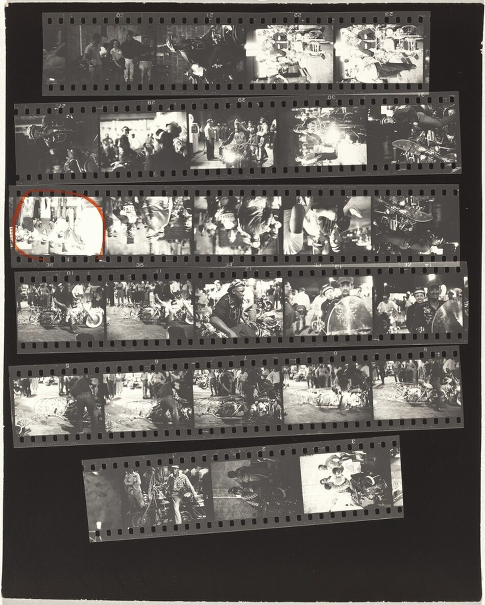 This is a photograph of film contact sheets featuring multiple frames of motorcycles and gatherings. The black and white image shows several strips of film displaying a series of photographs. Each frame captures scenes related to a motorcycle event or gathering, with people standing around motorcycles. The images depict individuals posing with motorcycles, suggesting a social event involving motorcyclists. The frames are sequenced systematically, commonly used for previewing photographs before enlarging them.
