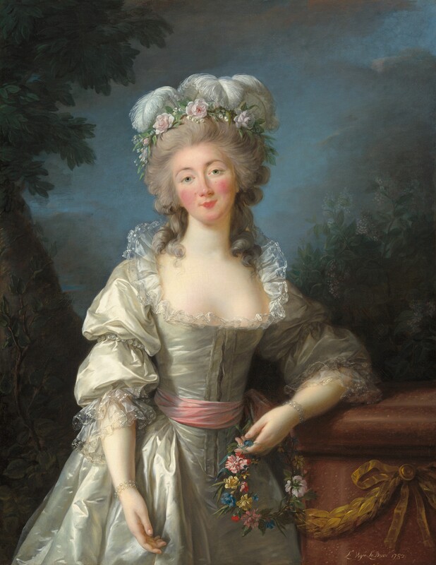 Shown from the knees up, a woman stands facing and looking at us with her head tilted a little to our left in this vertical portrait painting. She has pale skin, a heart-shaped face with rosy cheeks, and a rose-pink bow mouth. Thin, arched, sable-brown eyebrows frame her gray eyes. A wreath of pale pink flowers and curling white ostrich feathers crowns her long gray hair, which is piled high on her head. Loose curly tendrils brush both shoulders. Her glowing, silver satin gown is trimmed with delicate sheer lace around the wide, plunging neckline and sleeves, and has a pink sash around her narrow waist. Pearl bracelets adorn her wrists. She leans to her left, our right, to rest her left elbow against a waist-high, cinnamon-brown stone pedestal, which is decorated with a bronze-colored garland and bow on the side facing us. A ring of blue, yellow, red, and pink flowers, woven with strands of ivy, dangles in the hand resting on the pedestal. Her right hand hangs loosely by her side. Along the left edge of the dimly lit background, a tree with a thick trunk angles into the upper left corner. A smaller sapling grows just in front of it. On the right, bushes with olive and fern-green leaves dotted with lilac-purple flecks rise above the pedestal. Dark clouds fill most of the top third of the canvas but they part around her head to reveal the soft blue sky. The artist signed and dated the work in white in the lower right corner, “L. Vigée Le Brun 1782.”