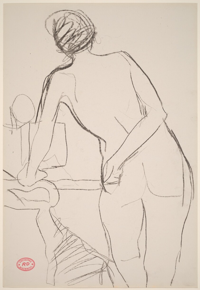 Untitled [standing female nude leaning on chair arm]