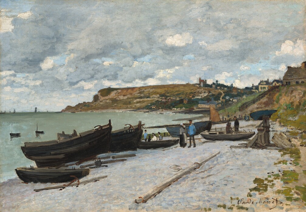 We look slightly down onto a silvery-gray beach nestled in a hilly, curving coastline to our right in this horizontal landscape painting. A flat expanse of beach stretches in front of us to meet the water to our left. The horizon comes about halfway up the composition, and the sky above is nearly filled with heather-gray and white clouds, with only a few patches of light blue sky. Several earth-brown and black boats are pulled up onto the beach, to our left. A few poles and one anchor lie among them. A single, light gray and white pole lies perpendicular to the rest, coming toward us in the sand, higher up on the beach. Along the beach, beyond these boats, a man stands next to a woman holding a baby. The man wears an aquamarine-blue shirt and black pants and cap, and the woman wears a dress with a gray shirt and black skirt, partially covered by a cream-white apron. Several other adults and children stand and sit near boats to either side of the pair. The people are loosely painted, with only a few swipes and touches of paint, so details are indistinct. To our right, moss-green and camel-brown dunes rise from the beach, which lead to higher hills along the shoreline. The beach curves away from us to our right and then back out to our left, like a backward C. A sailboat with a fawn-brown sail sits along the beach at the curve, in the distance. A few buildings, painted with gray, yellow, red, and navy blue perch atop some hills, and more are suggested with dabs and strokes of slate blue and parchment white in the valley between hills. Farthest from us, the land rises to a high, long, flat promontory that extends about two-thirds of the way across the painting. The water in the bay is frosty, seafoam green, and a few strokes of white along the shore suggest waves. The water’s surface is mostly flat with a couple small, ink-black boats floating near the left edge and more along the horizon. The artist signed the work in brown paint in the lower right corner, “Claude Monet.”