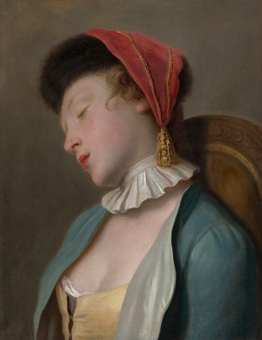 Shown from the chest up, a young woman with smooth, pale skin sleeps with her head tipped away from us in this vertical painting. Her face leans to our left so we see her delicate features in profile. She has faint brows, and her pink lips are parted. The tip of her nose and cheeks are also lightly flushed. Her brown curls are topped with a black fur cap, which is draped with a triangular, muted red cloth. The cloth comes to a point with a gold tassel, which hangs alongside her neck. A flaring, pleated, white collar encircles her neck, seeming unconnected to her other garments. Her topaz-blue bodice is open to show a butter-yellow corset beneath. The jacket is lined with cool, shimmering green. Her head tips alongside the arched, wooden back of her chair, which is upholstered with caramel brown edged with gold. The background is washed with tones of olive and dark green. The painting is created with blended strokes, giving it a soft, almost blurry appearance.