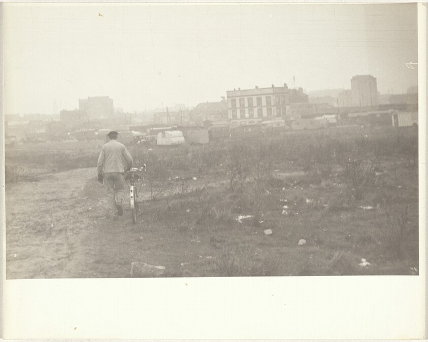 Man walking bicycle, Paris
