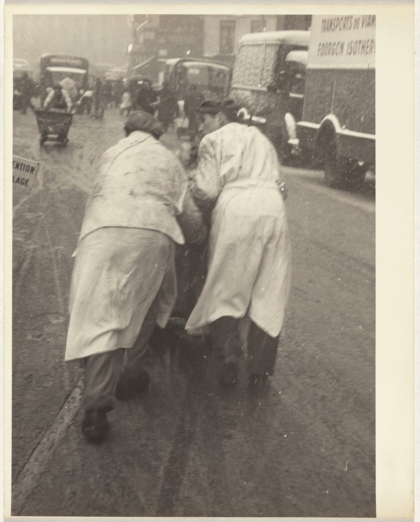 Men pushing cart, Paris