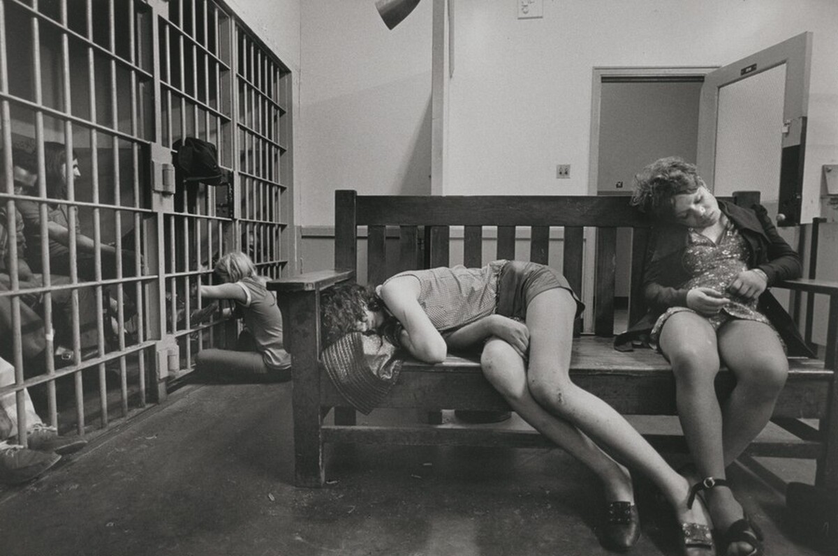 At night in a police station, the minors are set out of the cells. Mostly small-town teenage runaways, still wearing their mothers' lipstick, are picked up at night either by the police or pimps. "These girls in the picture are lucky; the pimps haven't gotten to them yet," said the fatherly officer. "They sleep the night here and in the morning we turn them over to the social workers," New York City