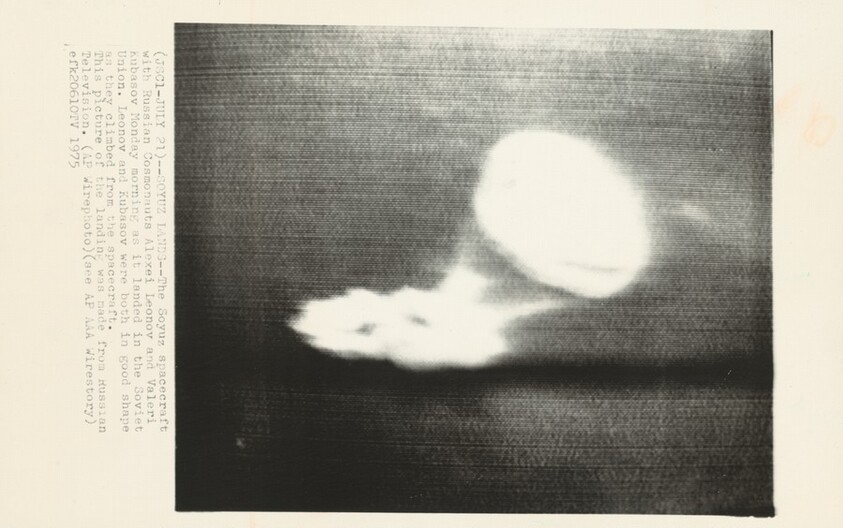 Title from caption on object: “Soyuz Lands”