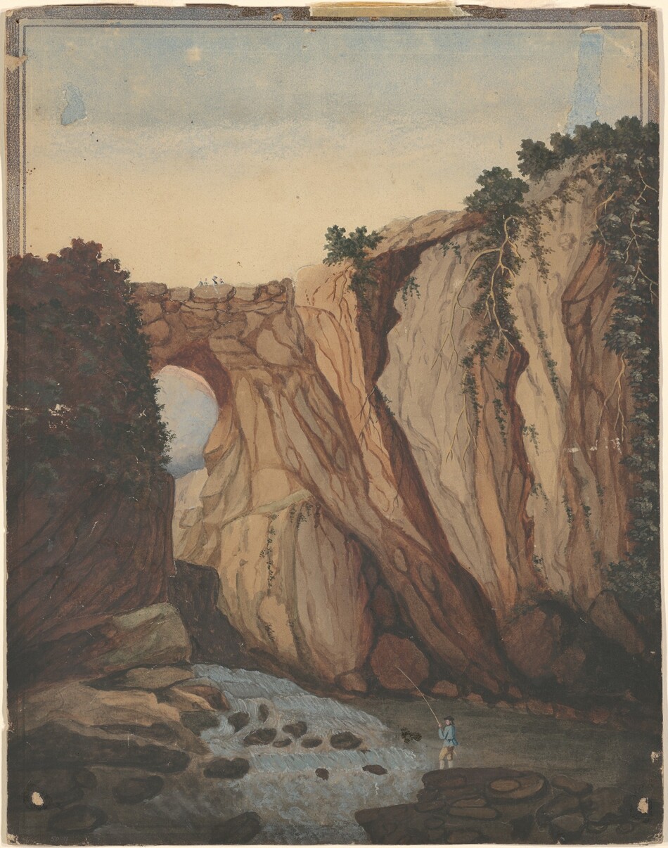 Against a watery blue sky, an arched rock formation joins tall cliffs that together fill most of this vertical watercolor painting. The arch is to our left, next to a plant-covered, tall outcropping. The cliffs dominate the right half of the composition. Lit from the upper left, the rocky faces are light and caramel brown with fog-gray fissures and cracks. The tops of the cliffs are fringed with dark green shrubs and a few long vines hang down some of them. A slate-blue river, dotted with rocks, winds from the lower center of the picture around to our left, before disappearing behind tall boulders there. Near the lower right corner and tiny in scale, a man wearing light blue and tan garments stands on the river’s edge holding fishing pole over the water. Upon closer inspection, a series of small dots of color suggest people crossing the top of the arched bridge. Above them, a buff-white and pale blue sky fills the top third of the scene.