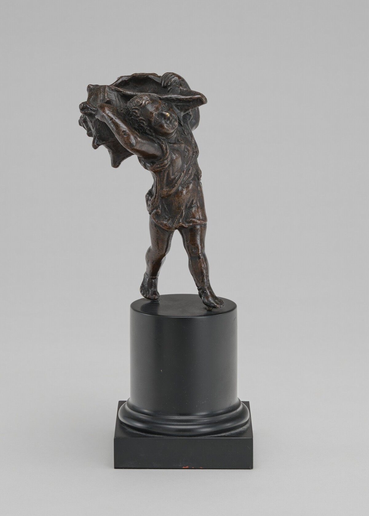 Inkwell in the Form of a Child Carrying a Shell