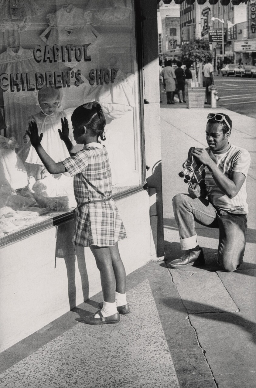 Member of Southern Media Photographing a Young Girl, Farish Street, Jackson, Mississippi