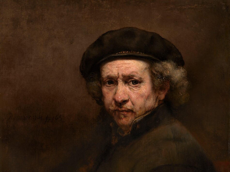 Shown from the waist up, an older man with pale, peachy skin looks out at us with deep-set, gray eyes under a furrowed brow, in front of a sable-brown background in this vertical portrait painting. His body is angled to our left, and his face turns to us. He has a faintly pink, bulbous nose, and his slightly sunken cheeks are shaded with gray. His peach-colored lips are framed with a wispy, gray mustache and goatee. Bronze-orange lines are incised within the battleship gray of his hair to create soft curls under his brown beret, which has gold trim around the base. The dark collar of his fawn-brown coat is turned up so his neck is covered. He is lit from the upper left, so his body and the right side of the painting are deeply shadowed. On our left, the canvas is painted with blended strokes of tawny and dark brown. His dark coat blends into the background, and his folded hands are in shadow in the lower left corner. The brushstrokes are visible in some areas, especially in the man’s face. The painting is signed and dated next to his shoulder, to our left, “Rembrandt f. 1659.”