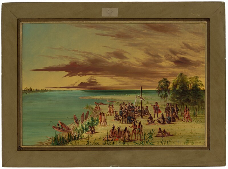 About twenty pale-skinned men and eighteen Indigenous people with medium-toned skin sit or stand in a gathering by a water’s edge in this horizontal landscape painting. Most of the people’s attention are focused on a pale-skinned man who stands and holds a rifle across his torso in one arm and gestures with the other hand extended. He wears a brown suit, dark hat, a red, knee-length cloak, and a sword hangs at one hip. He motions toward a rudimentary cross that stands upright in the marshy grass next to a white flag on a pole. A ring of mostly pale-skinned men sit or stand around this, though one of those seated there appears to have red-colored skin and wear a feathered headdress. These men wear brown pants and brown or blue coats with dark hats. Other Indigenous people with long black hair and some with red face paint stand or sit in an outer ring around the central action. Some of these people are bare-chested and some wear tawny-brown wraps, cloaks, or garments. Eight canoes are lined up along the zigzagging water’s edge in the left half of the painting, and people fish from two of them. The far coastline is lined with green and brown strokes, suggesting trees. Copper-brown clouds sweep across the sky, which darkens from pale yellow along the horizon, halfway up the composition, to blue along the top. The painting appears to be surrounded with a wide brown frame with a slip of paper reading “22” at the top center, but this is all painted and drawn. The artist signed the painting in the lower right corner of the landscape, "G. Catlin P.”
