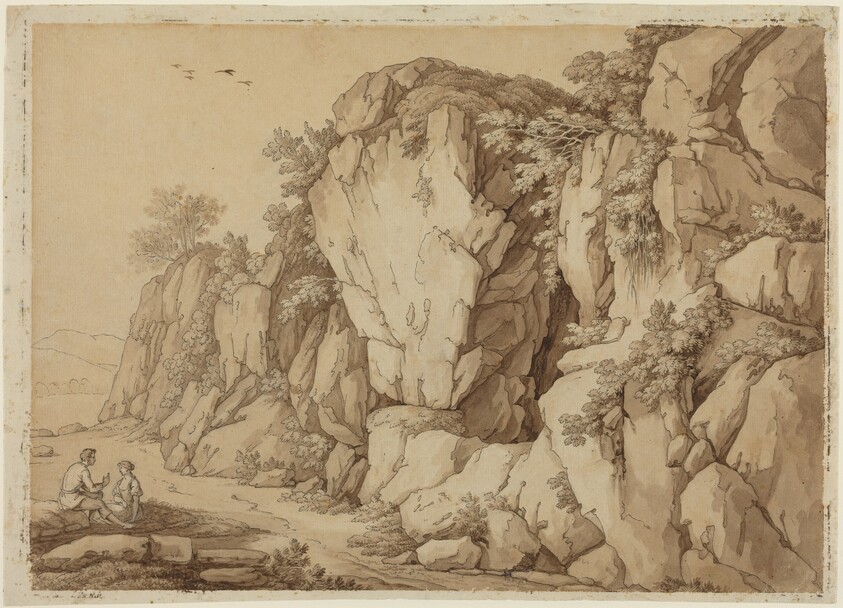 A Young Couple Seated near a Massive Rock Formation