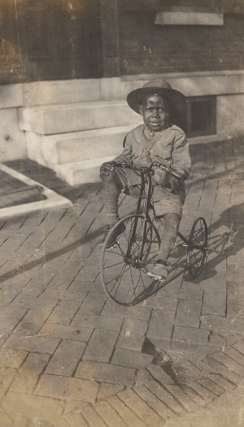Portrait of a Child on a Tricycle
