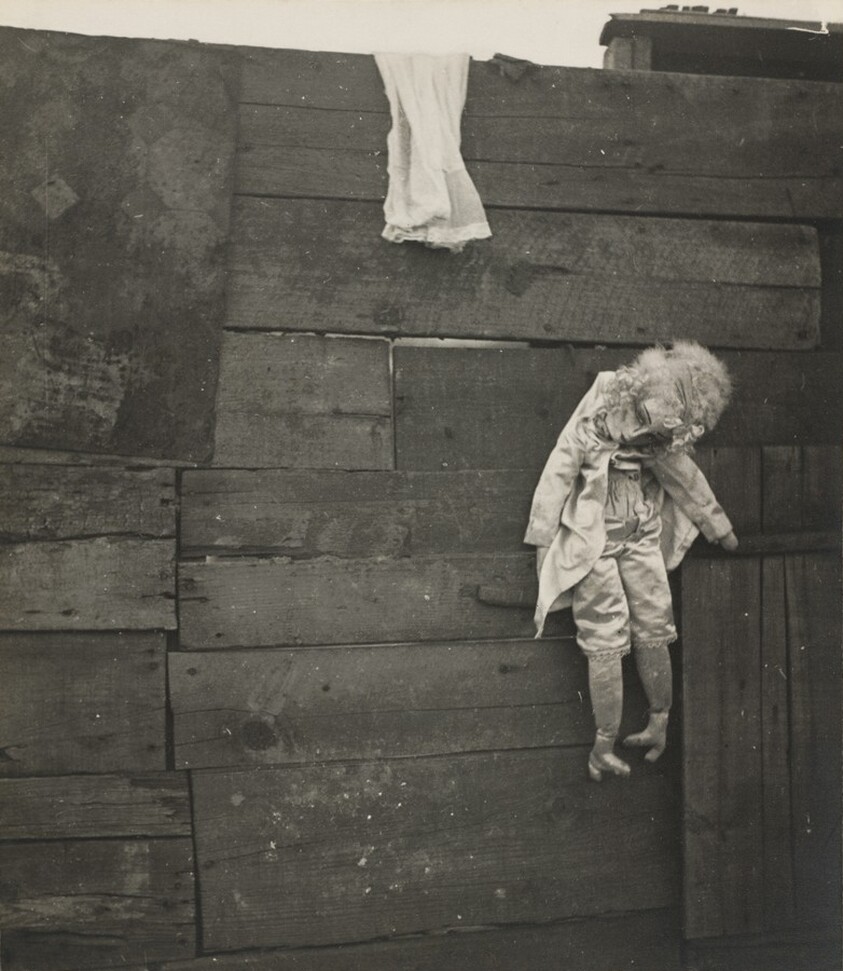 Untitled (Puppet Hooked on a Fence)