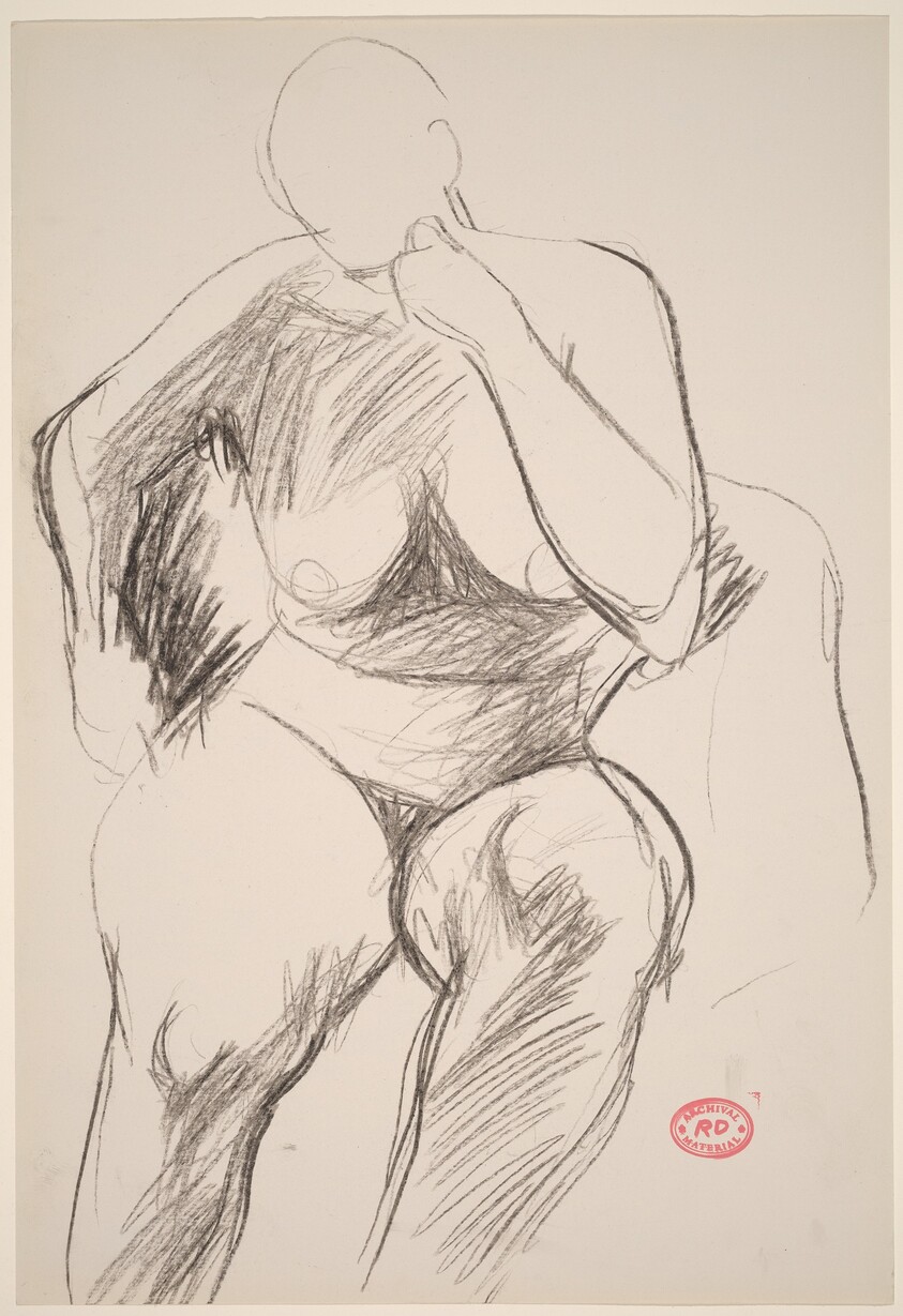 Untitled [female nude seated in armchair]