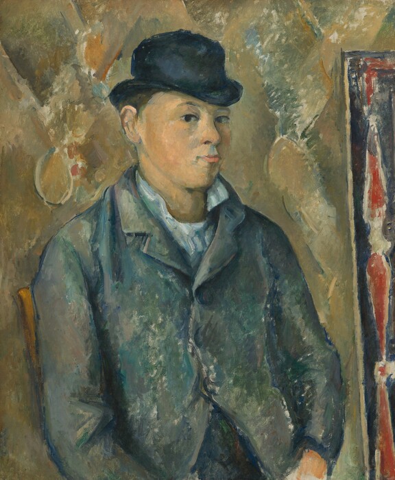 Shown from the waist up, pale-skinned young man wearing a bowler hat looks at us from the corners of his eyes in this vertical portrait painting. His body is angled to our right, and he cuts his dark eyes back to look at us, his lips pursed. He has a wide face, round cheeks, and a narrow chin. His white lapels are flipped up, and he wears a buttoned blue jacket. The black bowler hat seems a little too small for his head. The man and setting are painted with areas of mottled, streaked color. For instance, his peachy face is shaded with visible strokes of slate blue. His white collar is a blend of ice blue and frosty green, and his jacket is built up with daubs and strokes of marine blue, moss green, and gray. The white of the canvas underneath shows through in some areas, especially in the jacket. The wrist of one hand resting in the man’s lap is visible, and the back rail of the wooden chair in which he sits peeks out past the shoulder to our left. The wall behind him is painted loosely with the suggestion of a diamond pattern in laurel and olive green, parchment brown, rust orange, and muted blue. A rail or frame running close and parallel to the right edge of the canvas is patterned with elongated red teardrop shapes outlined by white, against a celestial-blue background.