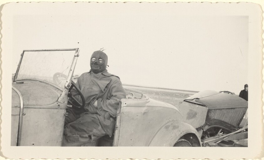 Untitled (Masked man sitting in car)