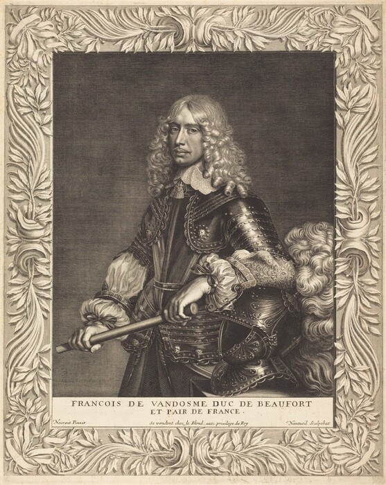 The image shows a man depicted from the mid-torso up. He is standing with his body slightly turned to one side while facing the viewer directly. His facial features include a long, narrow face with a pronounced nose, and thick eyebrows. He has long, curly hair that cascades down past his shoulders. He is dressed in elaborate clothing featuring a richly ornate armor with intricate detailing, over which a fabric with a finely embroidered lace collar is layered. The man is holding a baton or staff in one hand. The image is framed with an elaborate border of leaves and scrollwork. The background is a plain, subdued canvas.