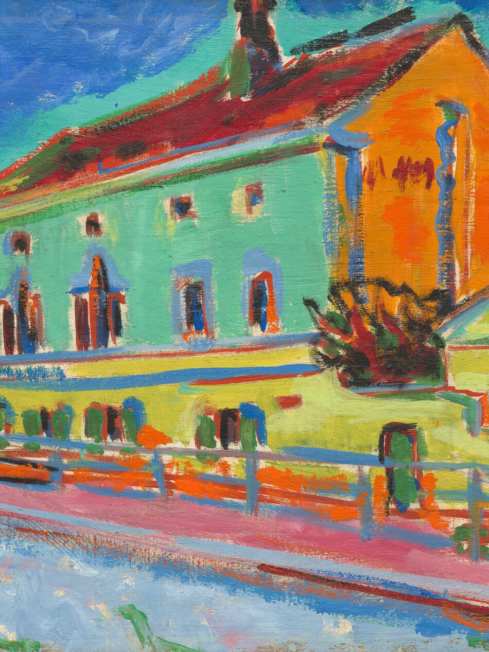 In saturated, vivid tones of mint green, marigold orange, dandelion yellow, sky blue, and rose pink, a long building stretches away from us along a walkway. The narrow end of the building facing us to the right is orange, and the long side is frosty green. The roof is painted garnet red, and the windows are created with slashes of midnight blue and dark red outlined with topaz blue. A wall enclosing the structure is lemon-lime yellow, and a fence in front of that is painted ultramarine blue. The walkway beneath the fence is pink and, to the left of that, pale blue. Two trees painted with twisting lines of ruby red, shamrock green, black, and off white edge into the scene along the left side, and the sky is lapis blue around a mint-green halo that surrounds the building’s roofline and walls. The scene is loosely painted with visible brushstrokes throughout.