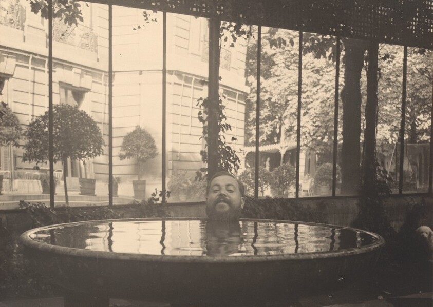 Christian Bérard's Head Posed at Edge of Basin of Water, Appearing to Float in the Water at the House of La Vicomtesse de Noailles