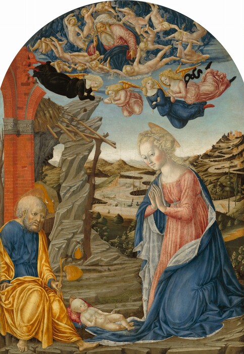 A kneeling woman and a sitting man are on either side of a nude baby boy as a bearded man, God, and winged angels hover in the sky over a deep landscape. This vertical panel has a rounded top. The people all have pale skin with pink cheeks, white-blond or gray hair, and wear robes in shades of carnation pink, azure blue, and buttercup yellow. The woman is larger in scale than the man sitting opposite her, and she has notably pale, white-colored skin. In the right half of the painting, she kneels facing inward over the baby with her palm and fingertips together in front of her chest. She looks down and to our left, past the baby, with pale gray eyes under thin brows. She has a long, delicate nose, thin lips, and a pointed chin. Her ice-blond hair is pulled up around a white band, and curls fall down past her shoulders. Her blue cloak is lined with white. The baby lies facing her on one end of the cloak, propped up on blue and dark pink pillows. The baby has a round pate and tiny features. He crosses his ankles and holds one hand up with the first two fingers raised. The man sitting to the left is balding with gray hair and a curly beard. His wide-set eyes slope down at the outer corners, and he looks down and to the right with his lips parted. He is barefoot and holds a short staff in one hand. The woman, baby, and man have disk-like gold halos. A canteen hangs from the low branch of a tree, and a sack lies at its foot just beyond the man. The ruins of a red brick arch and a shorn tree trunk support a thatched roof near the left edge of the painting. The rocky ground gives way to grassy hills dotted with trees in the background. A river winds to the horizon, which comes over halfway up the composition. Two birds float on the water and two bridges span it. A conical hill rises along the right edge of the painting. Against a pale blue sky in the top third, God has a beard, a lined forehead, and hooded eyes. He floats supported and surrounded by fourteen youths with short, gold wings. Seemingly countless winged baby heads painted in tones of cobalt blue create a cloud of its own behind God and the youths. Four older angels hover below. Two, who wear pink, have their hands together in prayer and the other two, wearing blue or black, cross their arms.