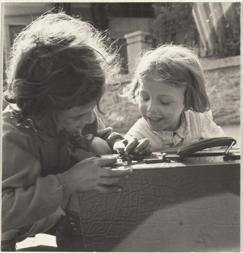 Girls playing with suitcase--Children