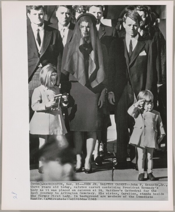 Title from caption on object: "John Jr. Salutes Casket"