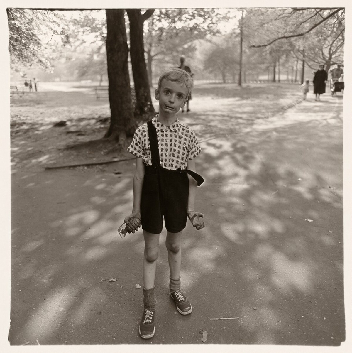 Child with toy hand grenade, N.Y.C. 1962