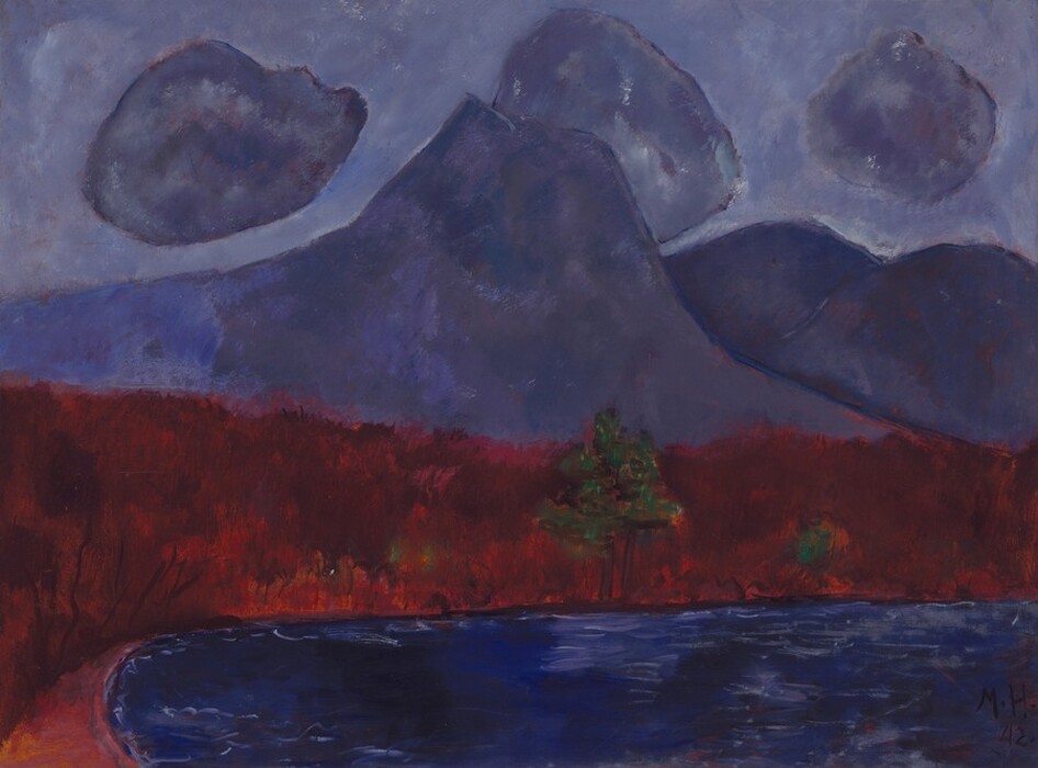 Amethyst-purple mountains and clouds against a slightly lighter, lavender-purple sky loom over a strip of land painted as bands of brick red and royal blue in this abstracted, horizontal landscape painting. One tall peak with a flattened top rises in front of a few more lower, rounded peaks to our right. Round clouds, like cotton balls, in the same amethyst-purple of the mountains, float against the lighter purple sky. The sky, clouds, and mountains are painted with areas of mottled purple over a red underlayer, all outlined in lapis blue. The horizon line created by the strip of deep red land comes about halfway up the composition. There is a pair of green trees with triangular canopies at the water’s edge near the center of the red band. A few touches of forest-green nearby suggest more trees or bushes. The red band is streaked vertically with visible brushstrokes in flame, ruby, and burgundy red. Along the bottom edge of the painting, the land curves toward us near the lower left corner, around a field painted with horizontal streaks of cobalt and navy blue with a few thin, white lines to suggest ripples. The artist signed and dated the painting in the lower right corner: “M.H. 42.”