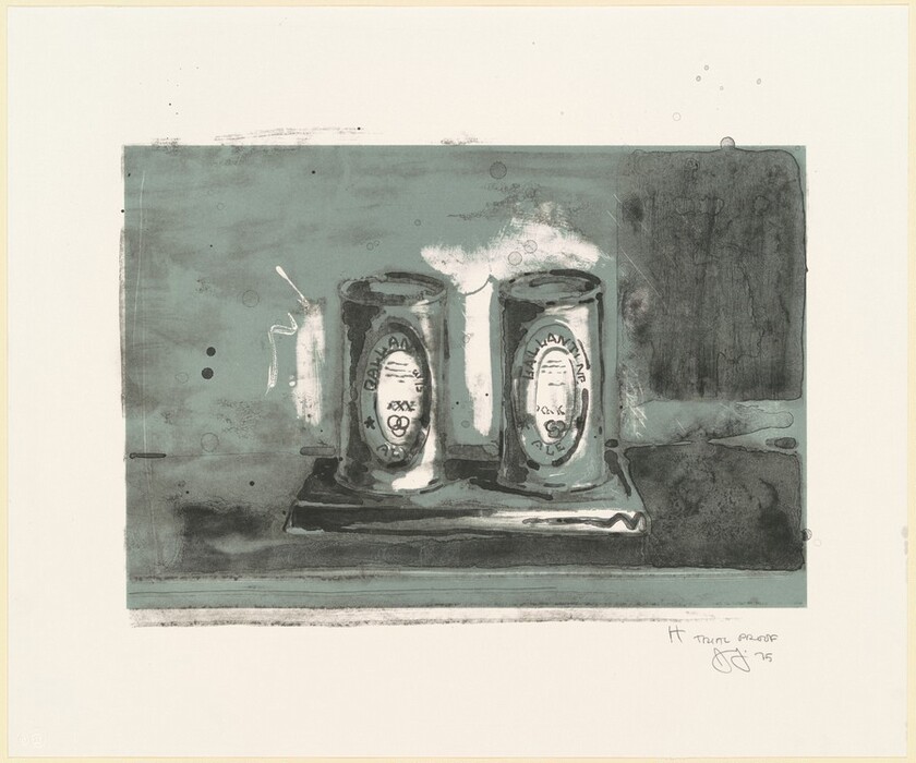 The image displays two cans labeled "Ballantine Ale" on a stand. The color palette is predominantly gray and muted teal. The cans are placed side by side on a rectangular platform in the center of the image, against a softly textured backdrop.